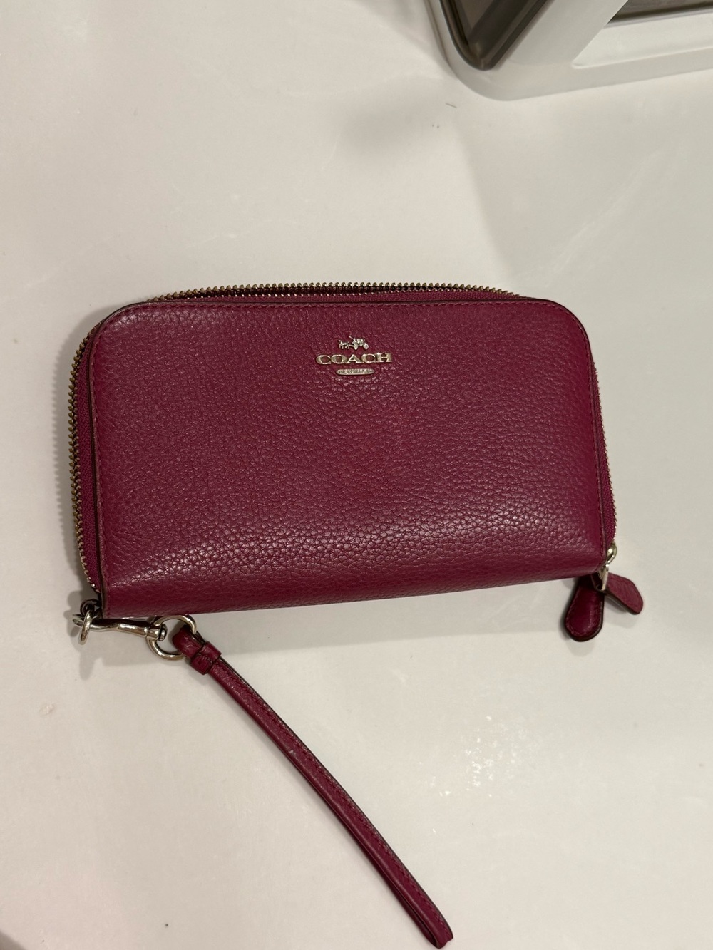 Coach Pebbled Leather Zip Wristlet in Berry Plum